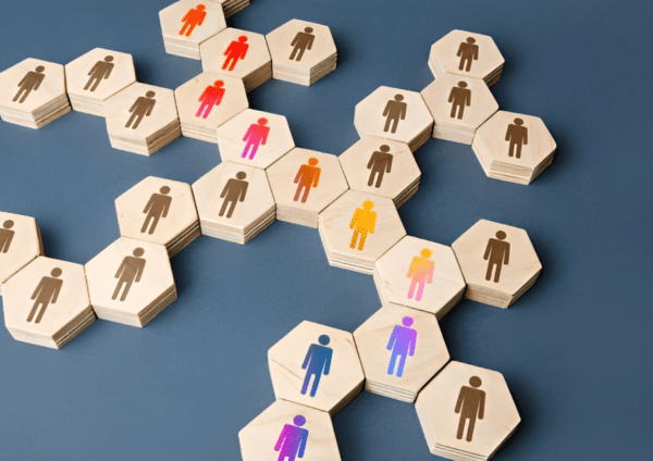 A group of people are arranged in hexagons.